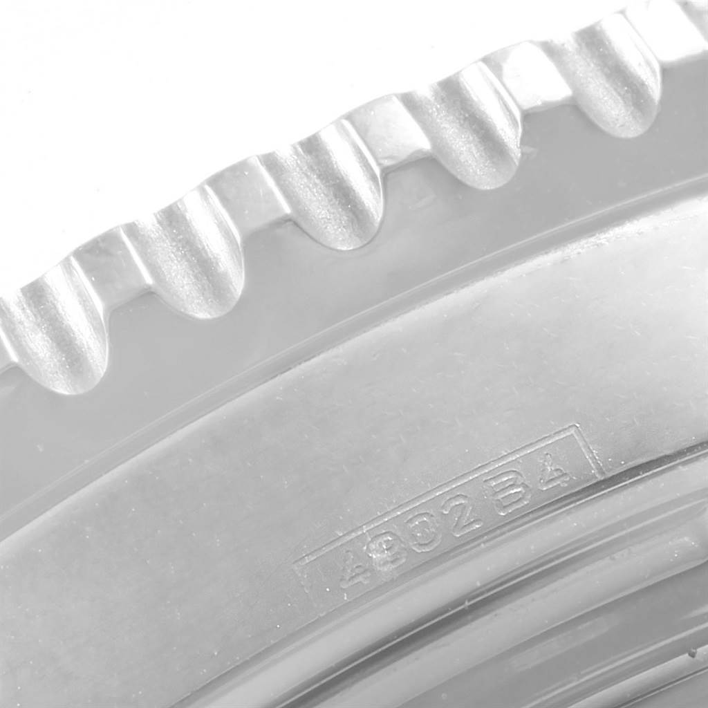 This image shows a close-up of the bezel and serial number area of a Breitling Navitimer A23322 Men's Stainless Steel Black Dial A23322 Men's Stainless Steel Black Dial watch.