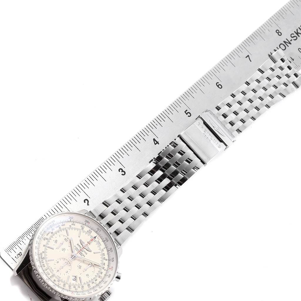 The image shows a Breitling Navitimer AB0123 Men's Stainless Steel Silver Dial AB0123 Men's Stainless Steel Silver Dial watch with a metal bracelet, partially measured by a ruler.