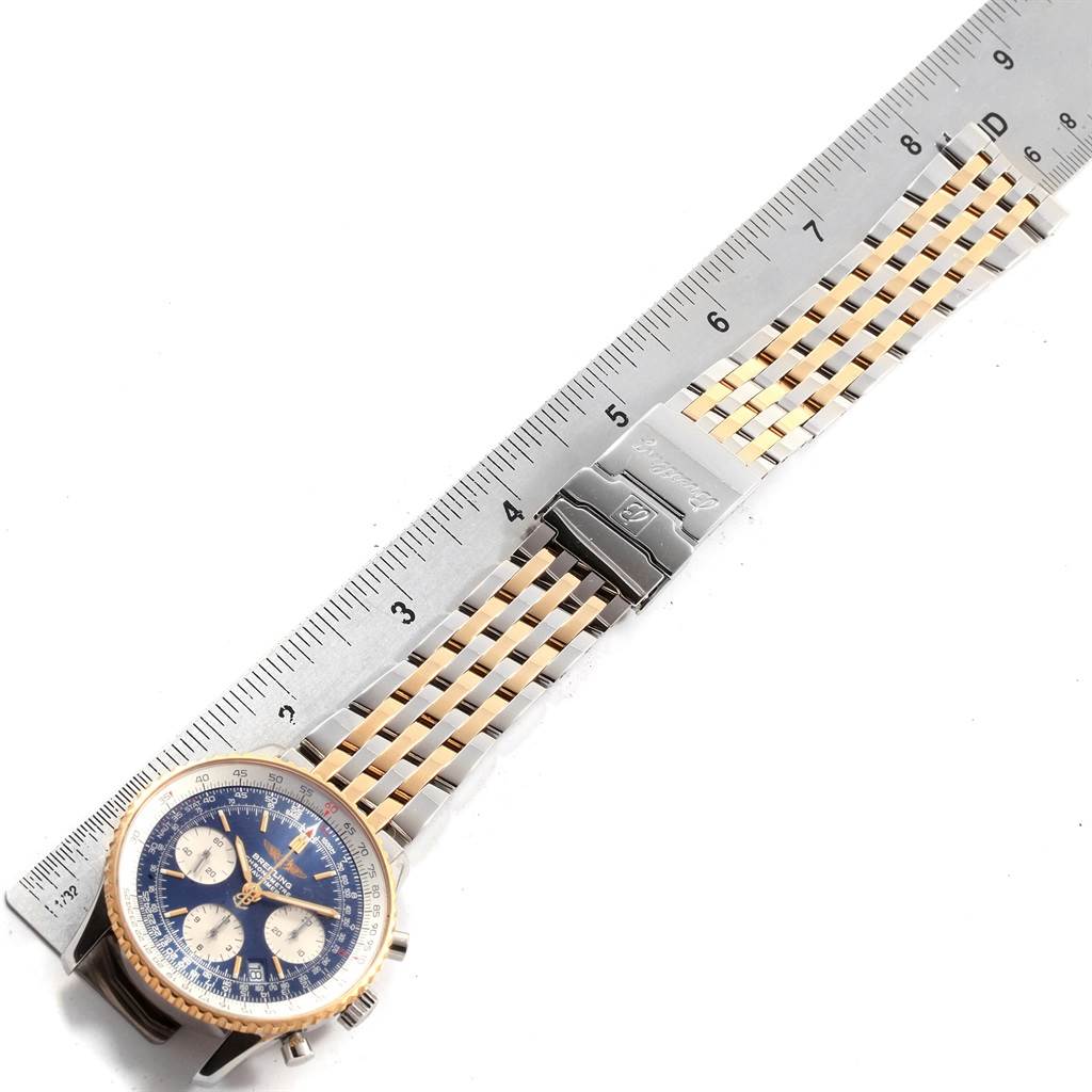 The Breitling Navitimer D23322 Men's Stainless Steel Blue Dial D23322 Men's Stainless Steel Blue Dial watch is shown from above, displaying its face, bezel, and metal bracelet with a ruler for scale.