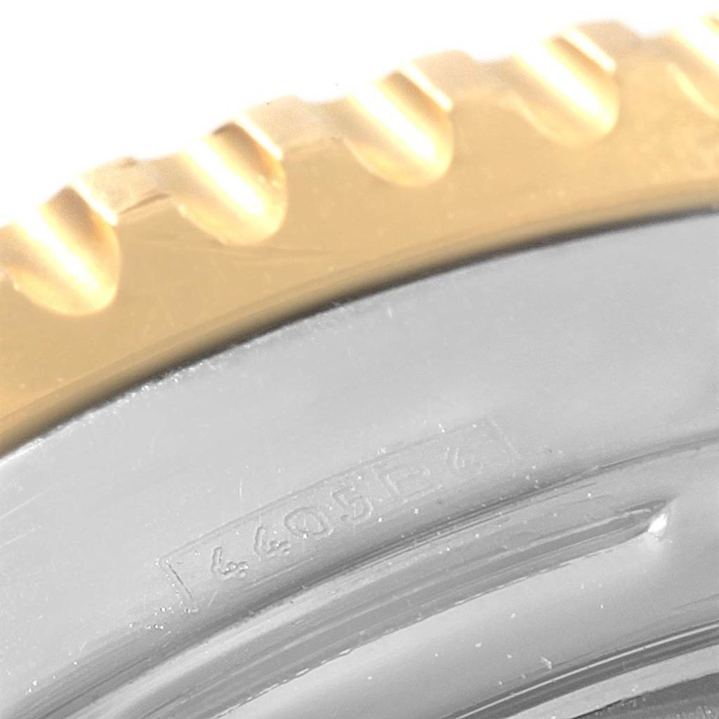 The image shows a close-up of the bezel and part of the case of a Breitling Navitimer D23322 Men's Stainless Steel Blue Dial D23322 Men's Stainless Steel Blue Dial watch.