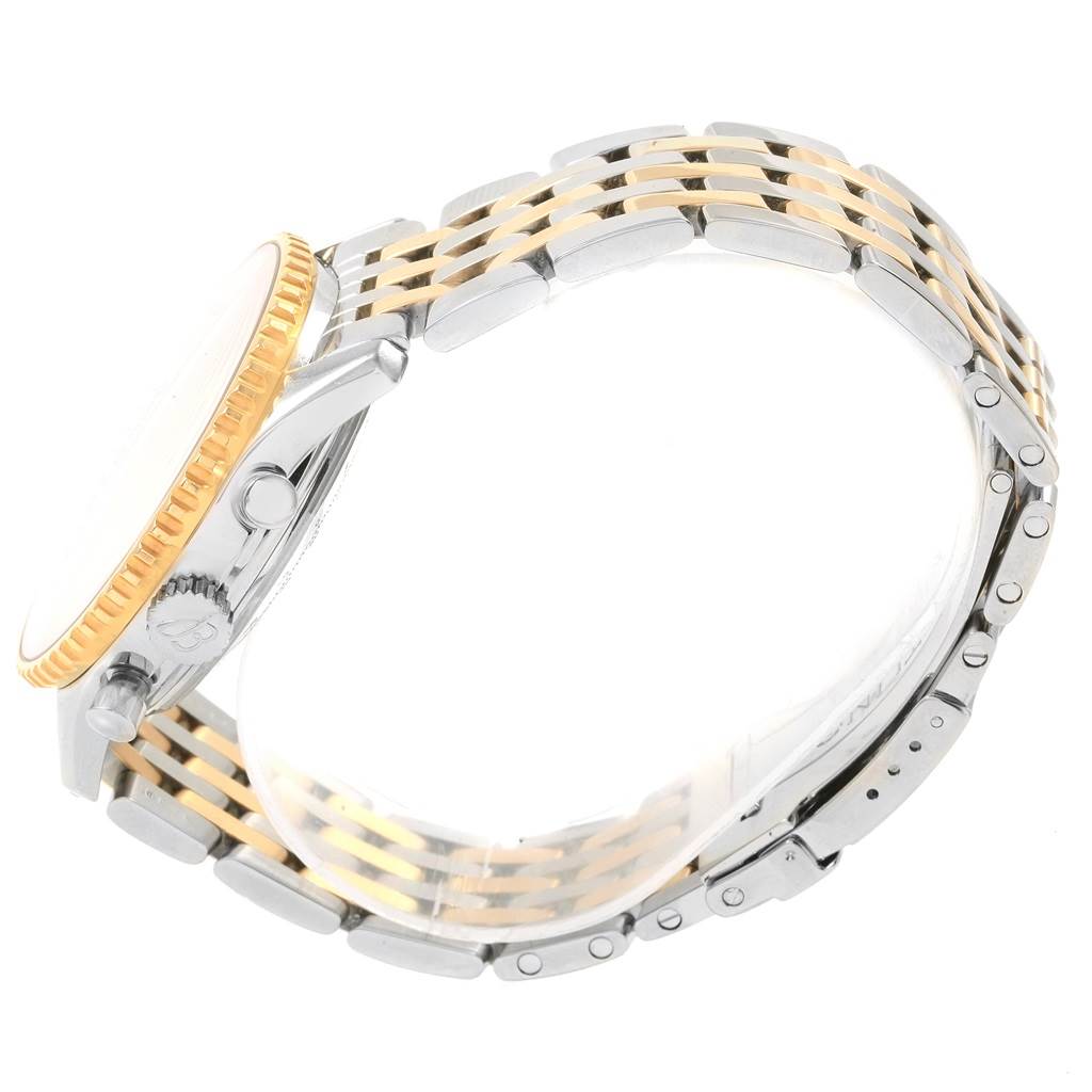 This image shows a side profile view of a Breitling Navitimer D23322 Men's Stainless Steel Blue Dial D23322 Men's Stainless Steel Blue Dial watch, highlighting its bezel, crown, pushers, and two-tone bracelet.