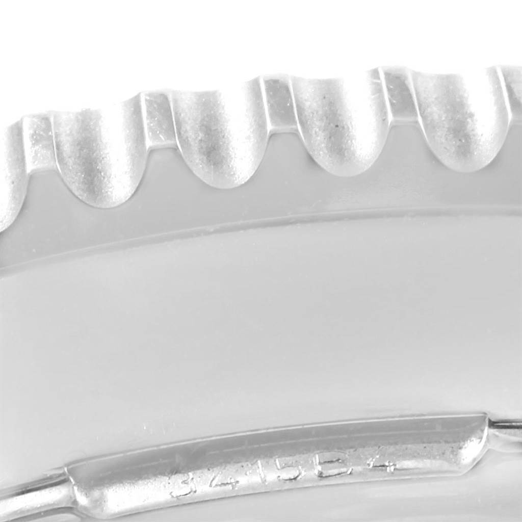 The image shows a close-up of the bezel and part of the casing of a Breitling Navitimer AB044121-BD24-442X-A20D.1 Men's Stainless Steel Black Dial AB044121-BD24-442X-A20D.1 Men's Stainless Steel Black Dial watch.