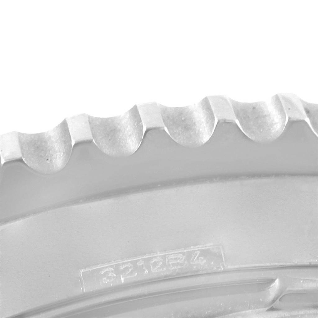 This image shows a close-up of the serrated bezel from a Breitling Navitimer AB0125 Men's Stainless Steel Blue Dial AB0125 Men's Stainless Steel Blue Dial watch.