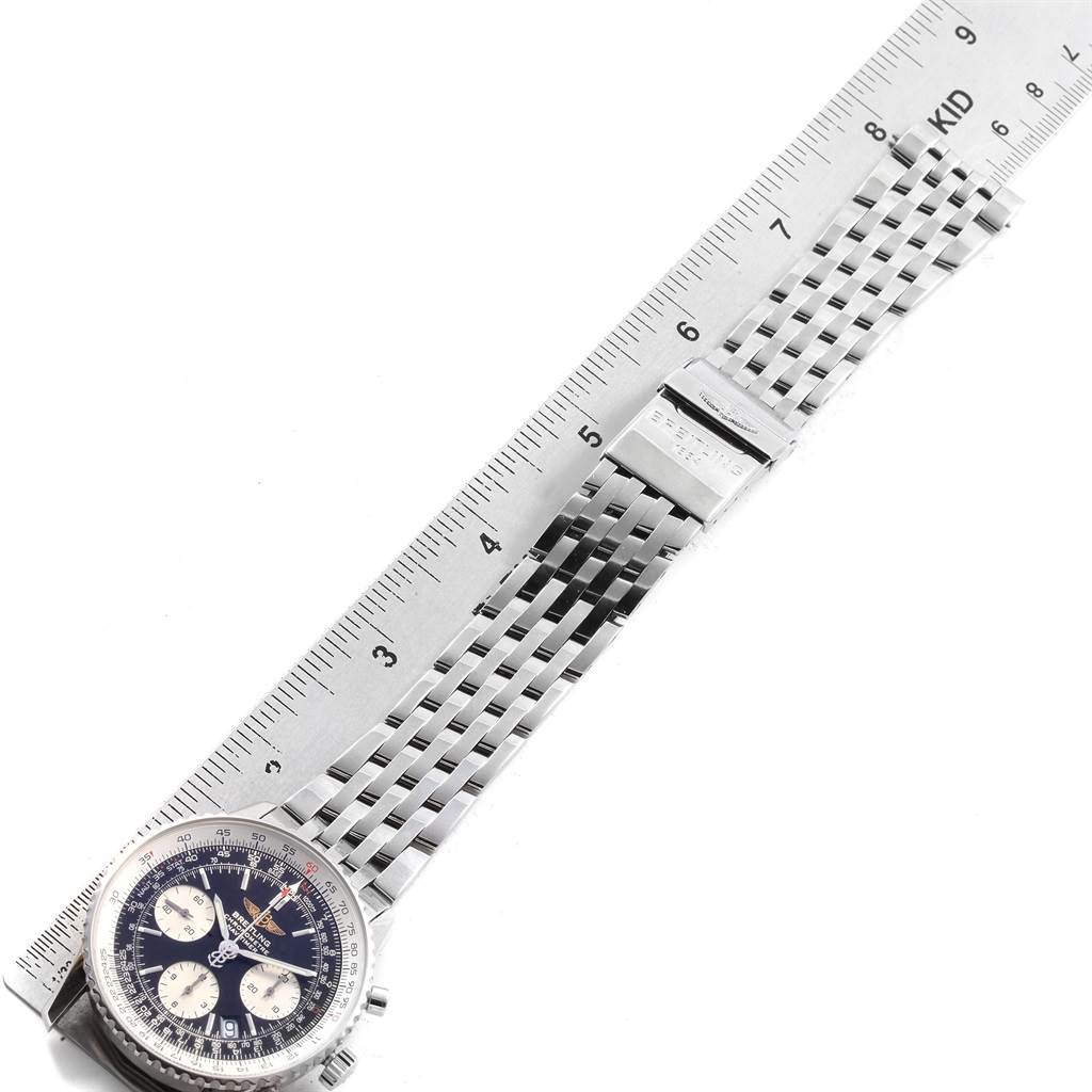 The image shows a Breitling Navitimer A23322 Men's Stainless Steel Black Dial A23322 Men's Stainless Steel Black Dial watch laid flat with a ruler measuring its metal bracelet.