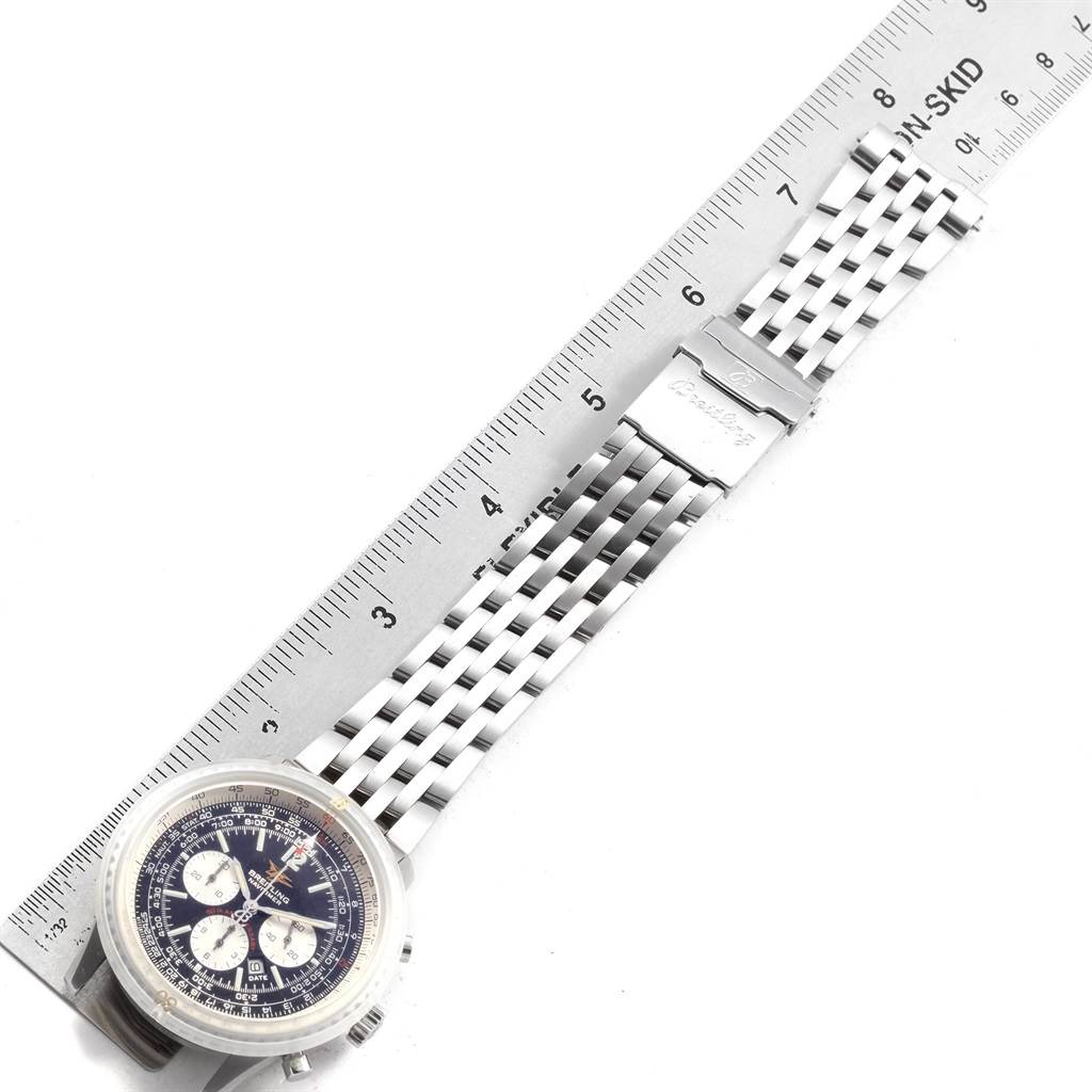 The image shows a Breitling Navitimer A41322 Men
s Stainless Steel Black Dial A41322 Men
s Stainless Steel Black Dial watch laid flat, with a ruler used to measure its stainless steel bracelet.