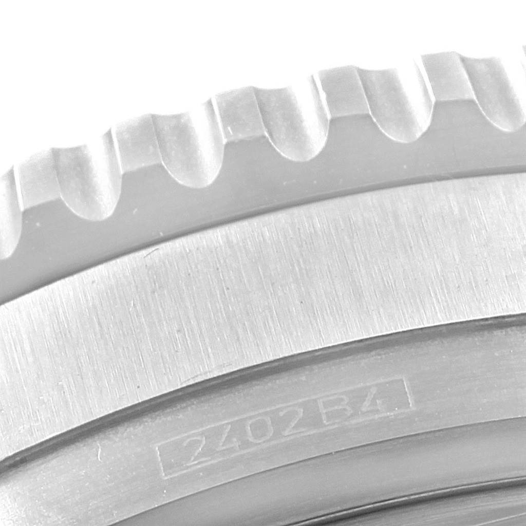 This close-up image shows the textured edge and serial number engraving on the bezel of a Breitling Navitimer A41322 Men
s Stainless Steel Black Dial A41322 Men
s Stainless Steel Black Dial watch.