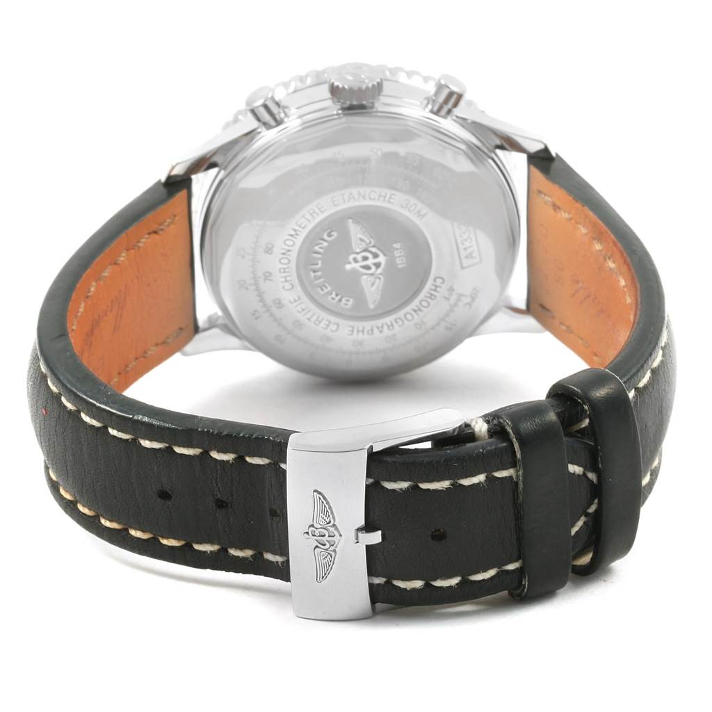 This image shows the back view of a Breitling Navitimer A13324 Men's Stainless Steel Silver Dial A13324 Men's Stainless Steel Silver Dial watch, displaying the case back and leather strap with a buckle.