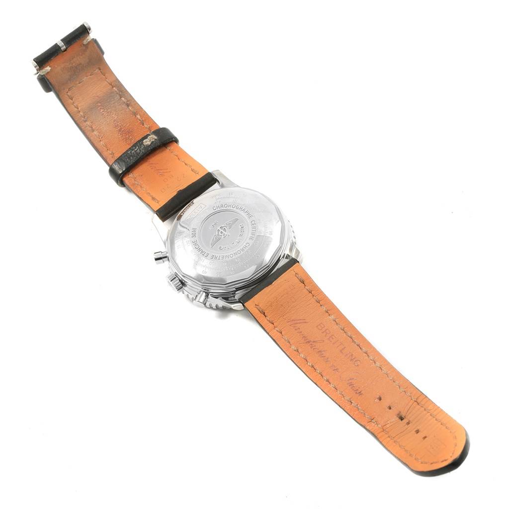 This image shows the back of a Breitling Navitimer A13324 Men's Stainless Steel Silver Dial A13324 Men's Stainless Steel Silver Dial watch and its leather strap, focusing on the case back and the buckle end of the strap.