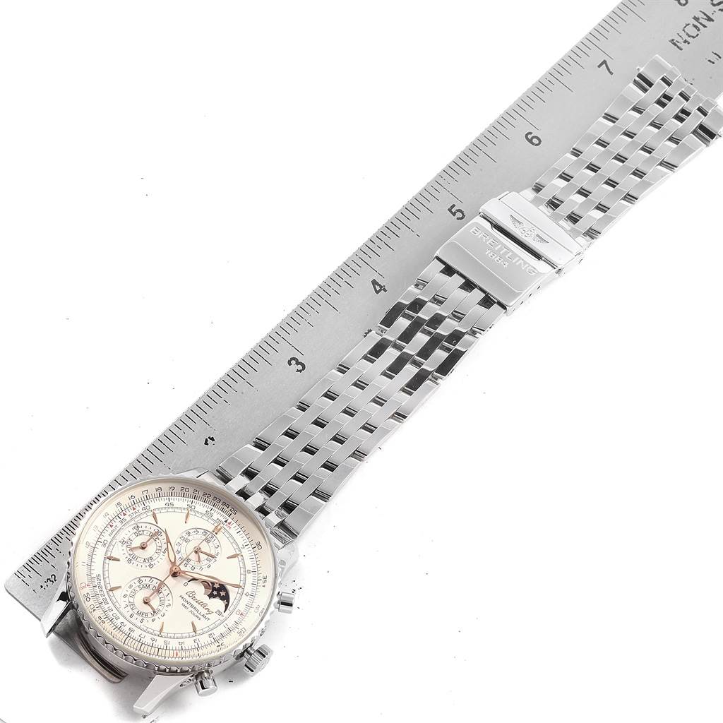 The image shows a Breitling Navitimer A19030 Men's Stainless Steel Silver Dial A19030 Men's Stainless Steel Silver Dial watch laid flat with a ruler, displaying the watch face and metal bracelet.