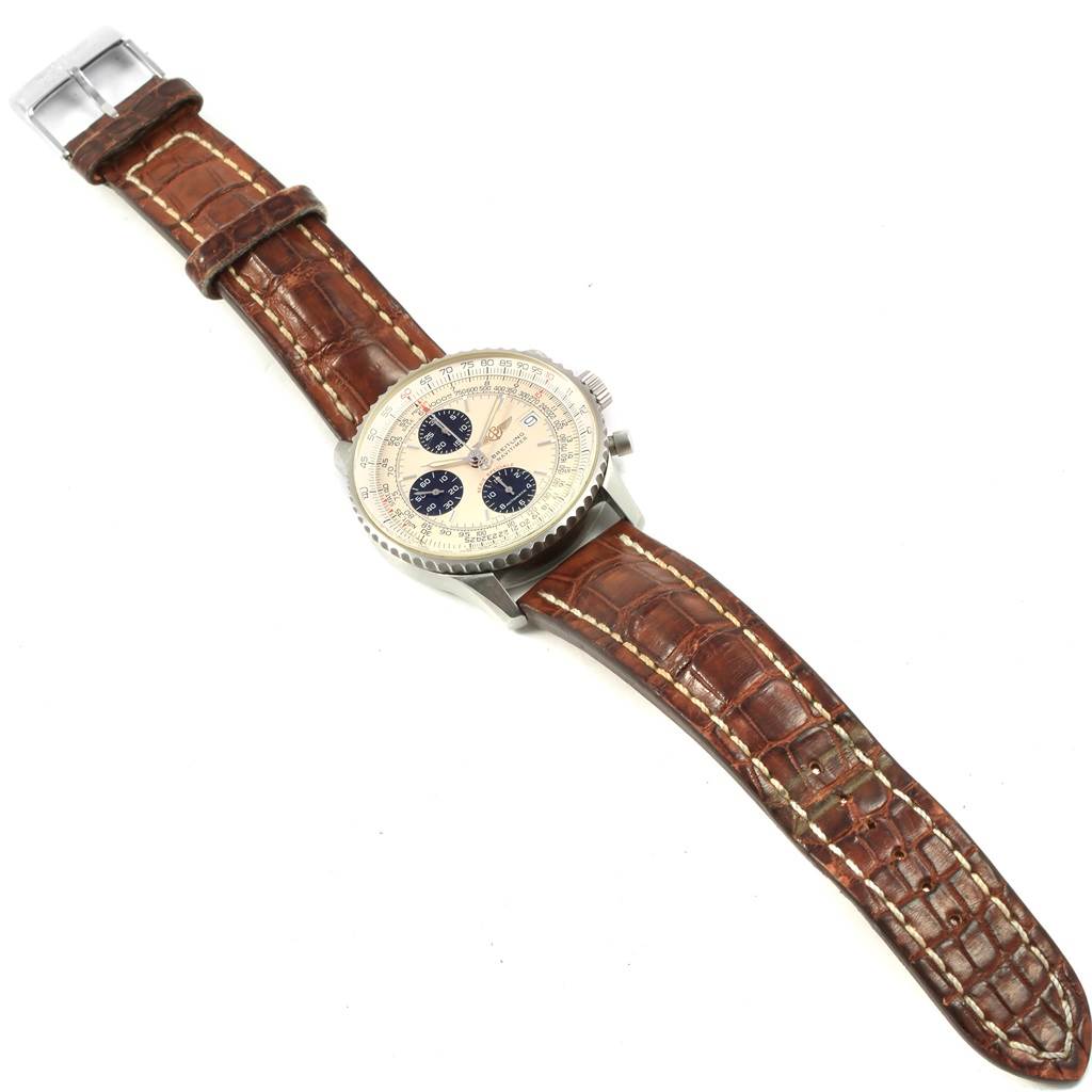 This image shows a Breitling Navitimer A13330 Men
s Stainless Steel Silver Dial A13330 Men
s Stainless Steel Silver Dial watch laid flat, displaying the dial, bezel, and brown leather strap.