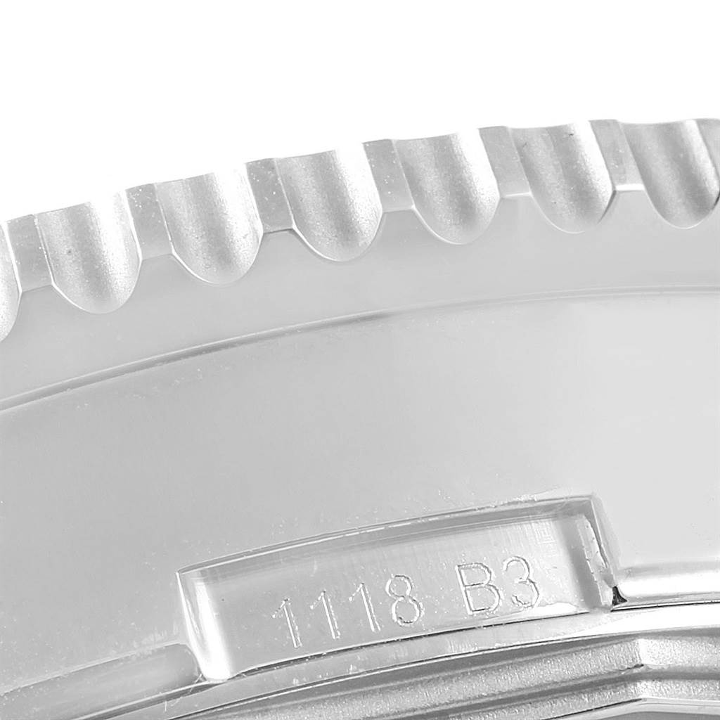 This close-up shows the bezel and part of the case with a serial number on the Breitling Navitimer AB0127211C1A1 Men's Stainless Steel Blue Dial AB0127211C1A1 Men's Stainless Steel Blue Dial watch.