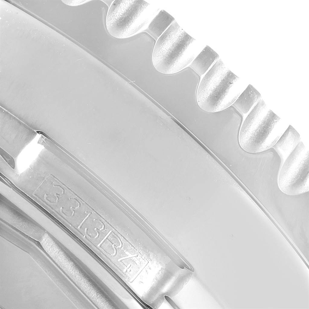 The image shows a close-up of the bezel edge and part of the bracelet clasp of a Breitling Navitimer A19370 Men's Stainless Steel Blue Dial A19370 Men's Stainless Steel Blue Dial watch.