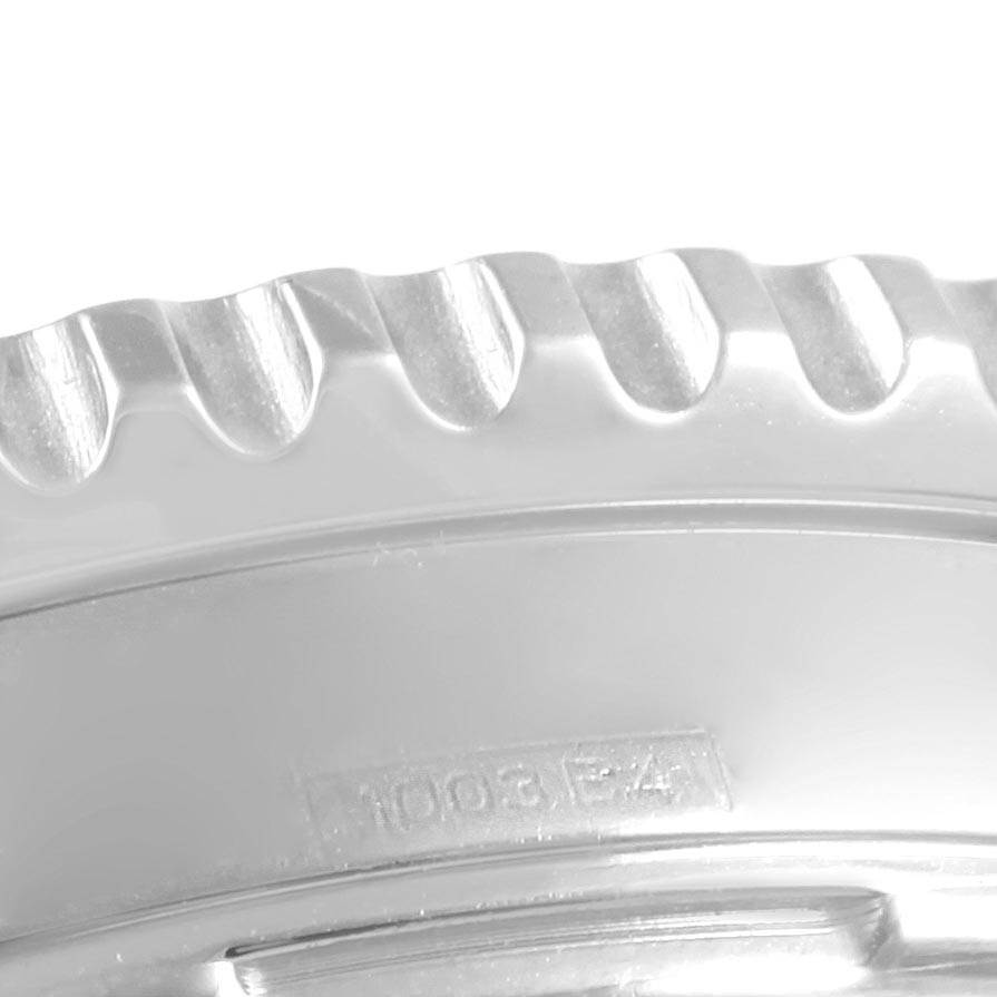 This close-up image shows the ridged bezel of a Breitling Navitimer A23322 Men
s Stainless Steel Silver Dial A23322 Men
s Stainless Steel Silver Dial watch.