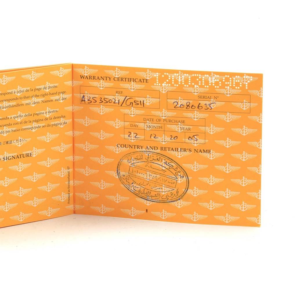 The image shows an opened warranty certificate for the Navitimer model by Breitling.