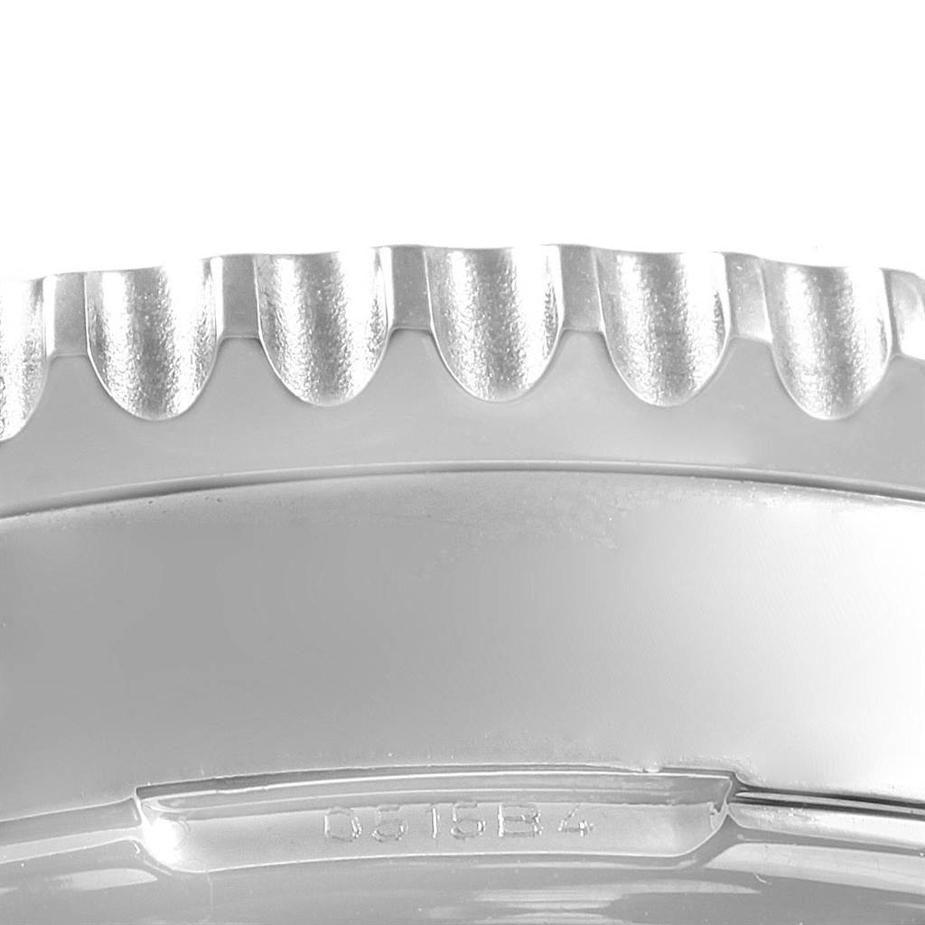 This close-up image shows the bezel and part of the case of a Breitling Navitimer AB044121-G783-453A Men's Stainless Steel Silver Dial AB044121-G783-453A Men's Stainless Steel Silver Dial watch.