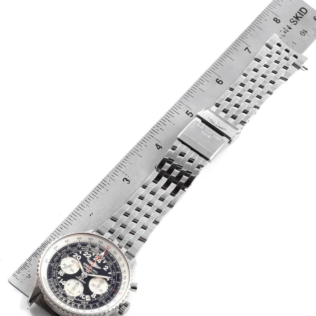 The image shows a Breitling Navitimer AB0210 Men's Stainless Steel Black Dial AB0210 Men's Stainless Steel Black Dial watch laid flat with its bracelet extended next to a ruler for measurement.
