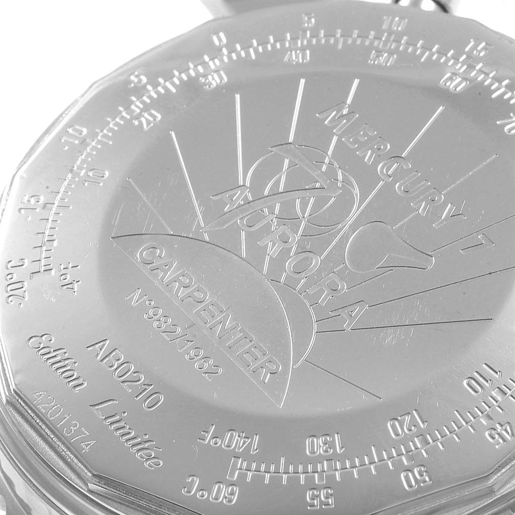 The image shows a close-up of the back case of a Breitling Navitimer AB0210 Men's Stainless Steel Black Dial AB0210 Men's Stainless Steel Black Dial watch, featuring engraved details and a scale.