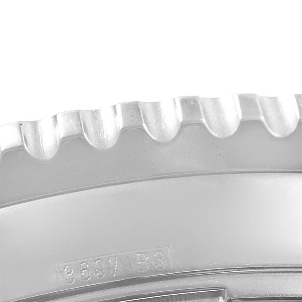 This image shows a close-up of the bezel and part of the case of a Breitling Navitimer A23322 Men
s Stainless Steel Black Dial A23322 Men
s Stainless Steel Black Dial watch.