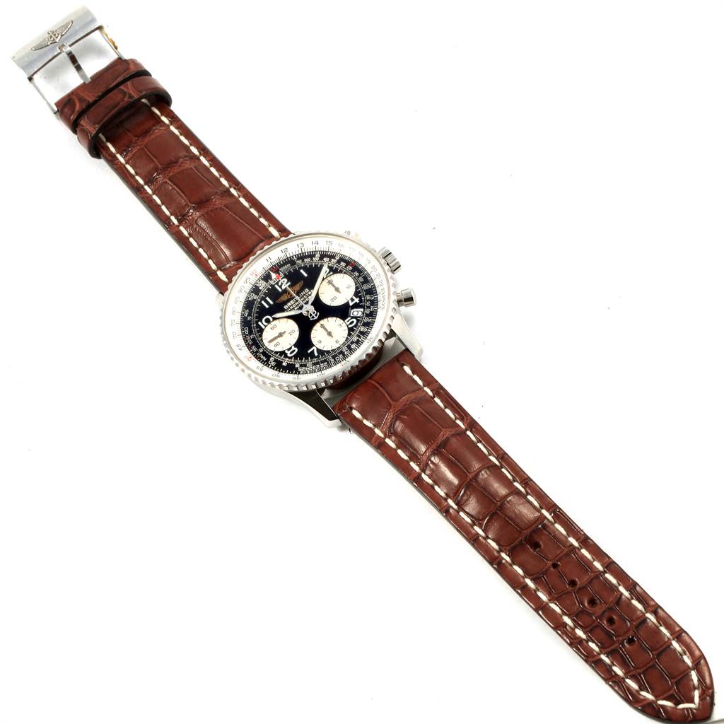 The image shows a Breitling Navitimer A23322 Men
s Stainless Steel Black Dial A23322 Men
s Stainless Steel Black Dial watch from a top-down angle, featuring a leather strap and detailed dial.