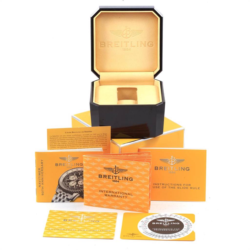 The image shows a Breitling Navitimer A41322 Men
s Stainless Steel Silver Dial A41322 Men
s Stainless Steel Silver Dial box, international warranty, instruction booklets, and a slide rule guide.