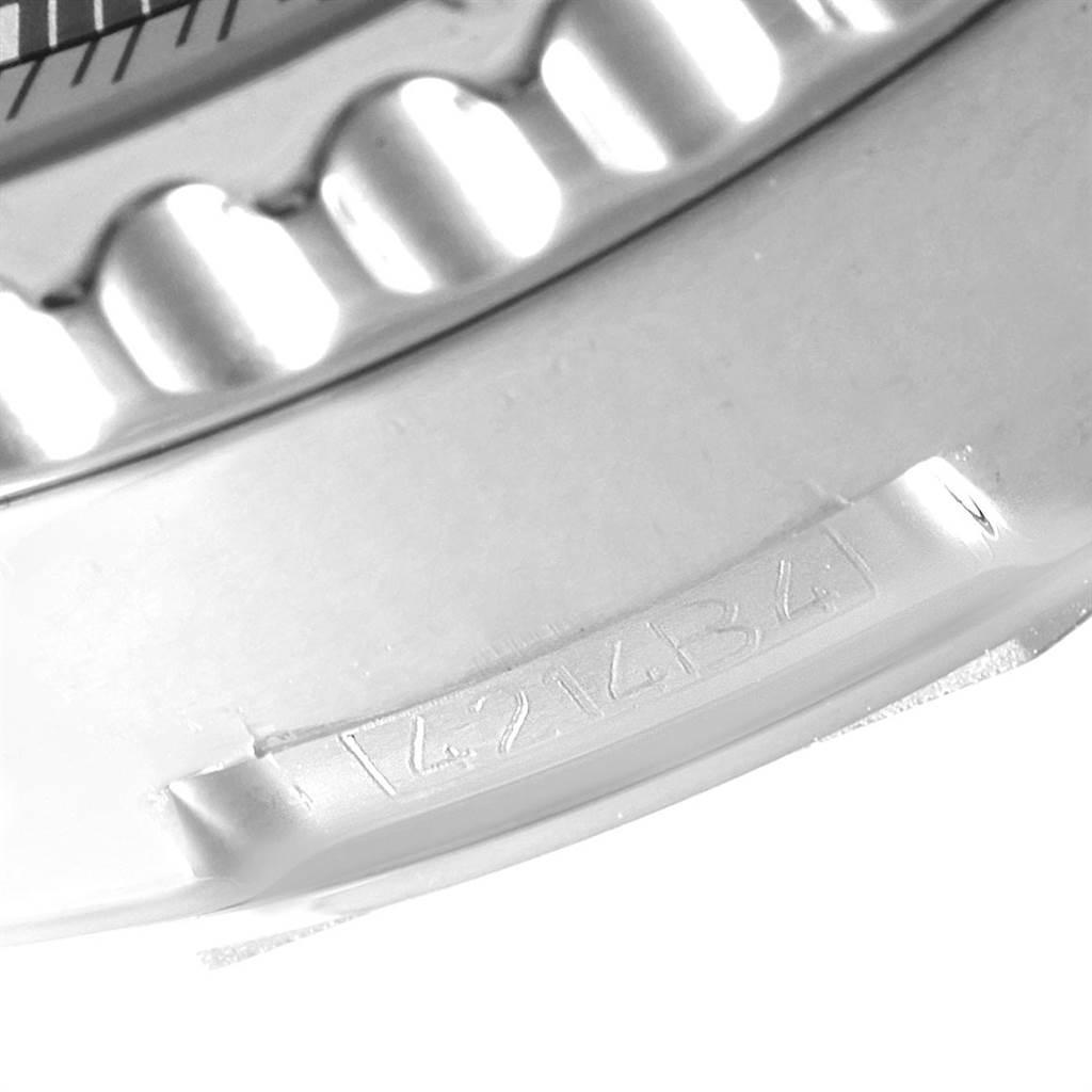 This close-up shows the bezel detail and engraved serial number of a Breitling Navitimer AB012721-C889-453A Men's Stainless Steel Blue Dial AB012721-C889-453A Men's Stainless Steel Blue Dial watch.