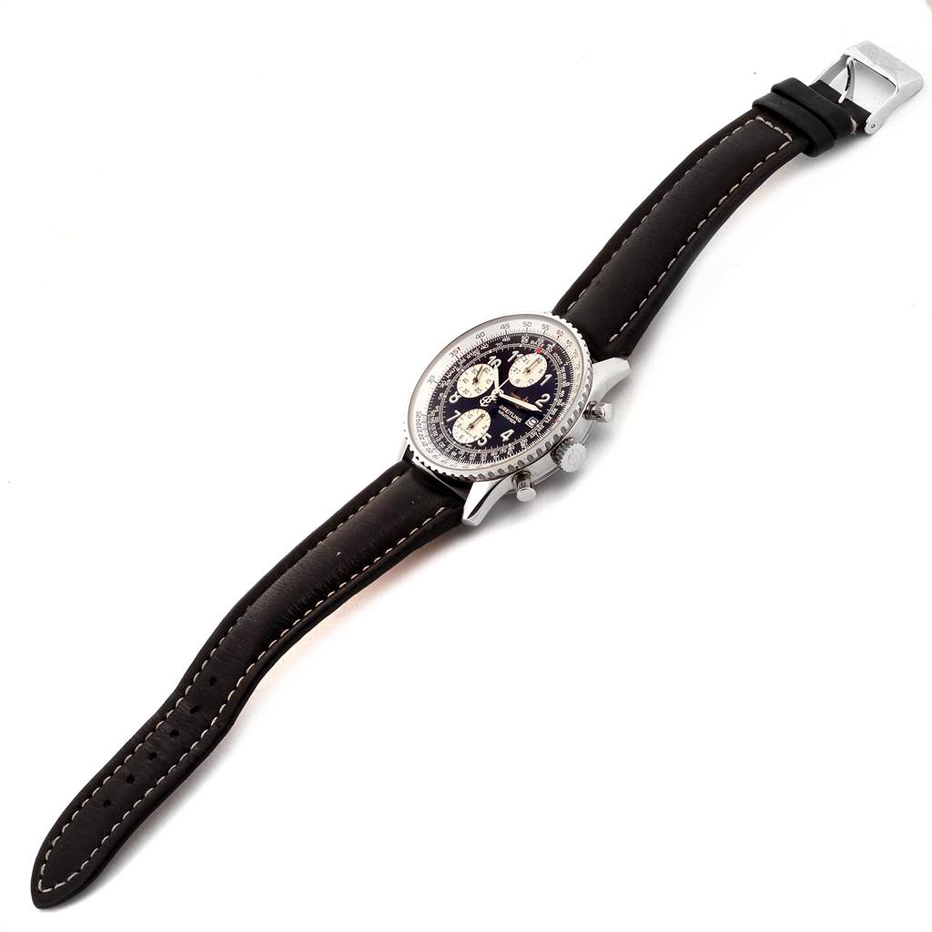 The image shows a Breitling Navitimer A13322 Men
s Stainless Steel Black Dial A13322 Men
s Stainless Steel Black Dial watch, featuring the dial, case, and leather strap from an angled top view.