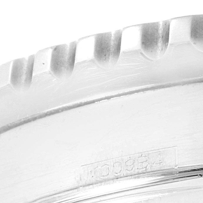 This close-up image shows the knurled bezel and a portion of the case edge of a Breitling Navitimer A23322 Men
s Stainless Steel Black Dial A23322 Men
s Stainless Steel Black Dial watch.