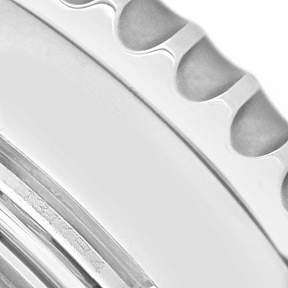 This image shows a close-up view of the bezel and part of the case of a Breitling Navitimer AB044121-G783-453A Men's Stainless Steel Silver Dial AB044121-G783-453A Men's Stainless Steel Silver Dial watch.