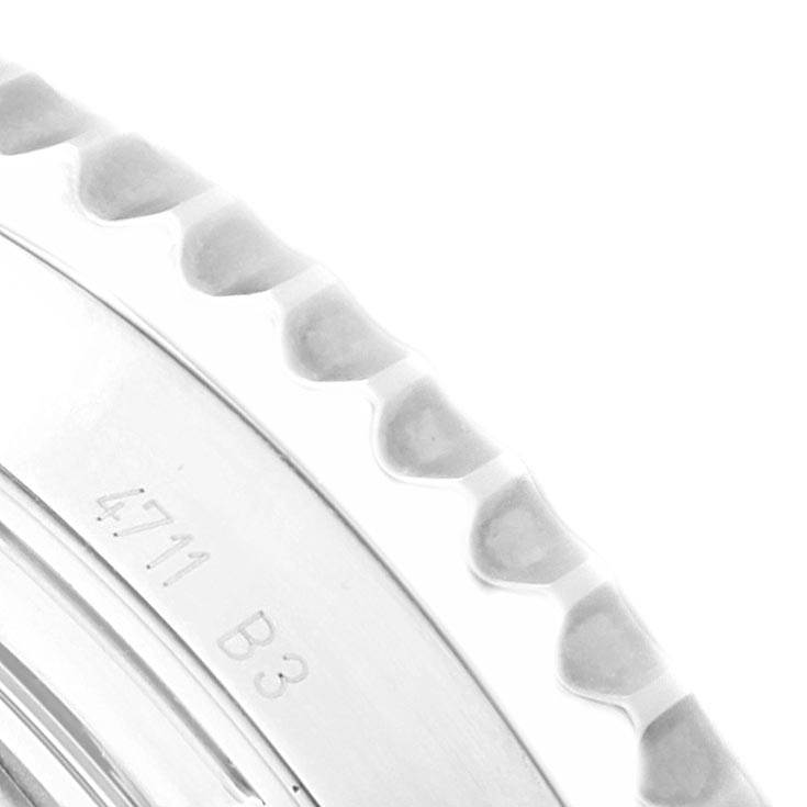 The image shows a close-up of the ridged bezel and part of the case from a Breitling Navitimer AB0120 Men's Stainless Steel Black Dial AB0120 Men's Stainless Steel Black Dial watch.