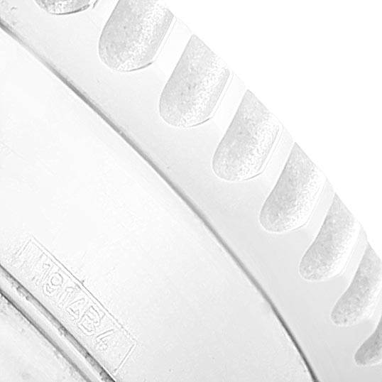 This close-up image shows the textured bezel and partial engravings on the Breitling Navitimer AB0120 Men's Stainless Steel Black Dial AB0120 Men's Stainless Steel Black Dial watch.