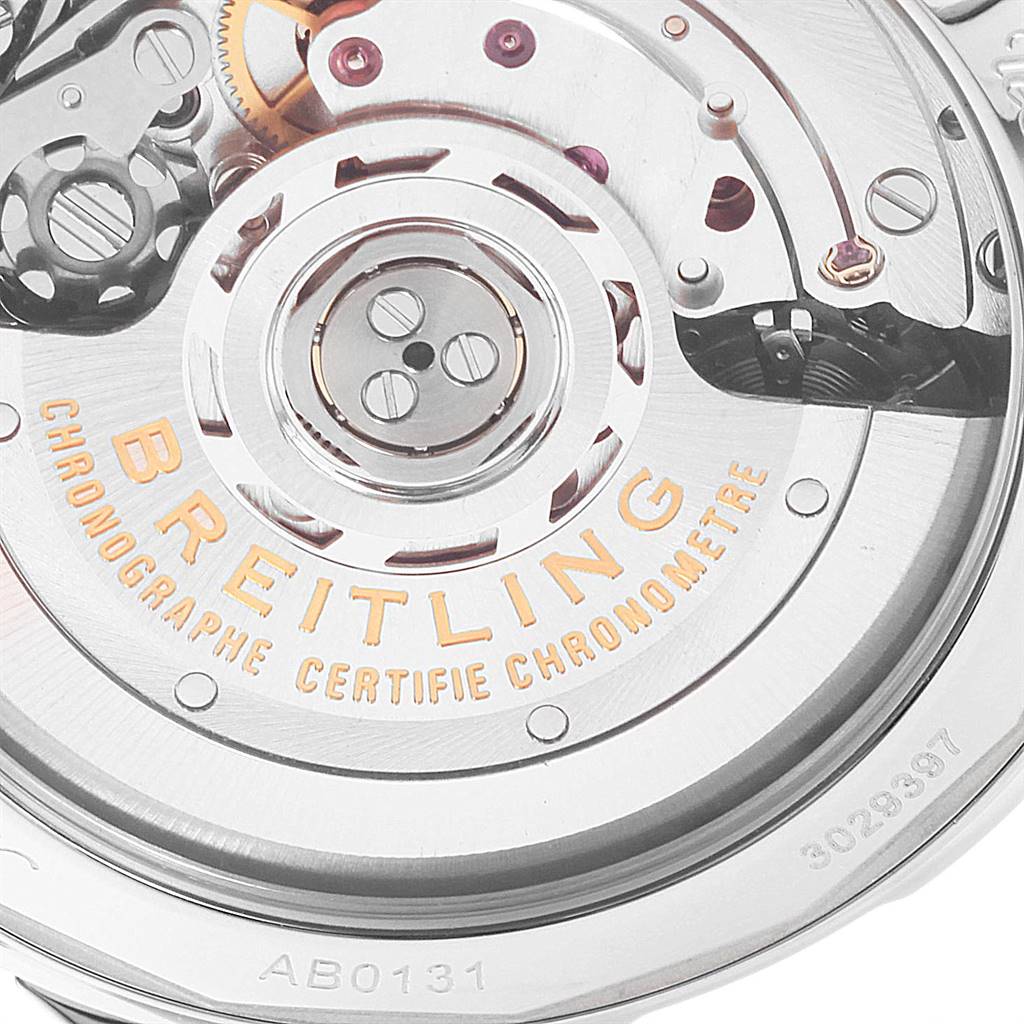 The image shows a close-up of the intricate mechanical movement of the Breitling Navitimer AB0131 Men's Stainless Steel Silver Dial AB0131 Men's Stainless Steel Silver Dial watch, including the balance wheel and gears.