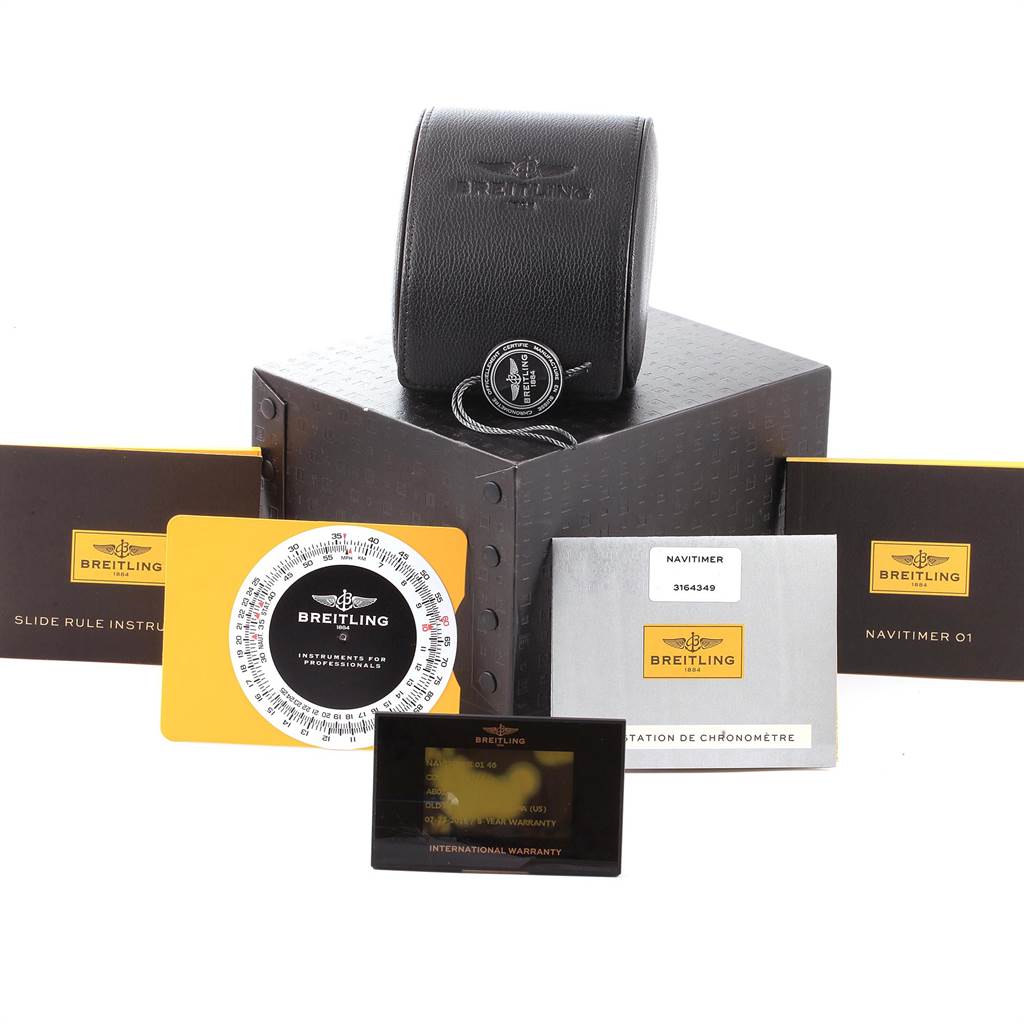 The image shows a Breitling Navitimer AB012721-C889-453A Men's Stainless Steel Blue Dial AB012721-C889-453A Men's Stainless Steel Blue Dial watch packaging, including a case, instruction manuals, a slide rule, and warranty cards.