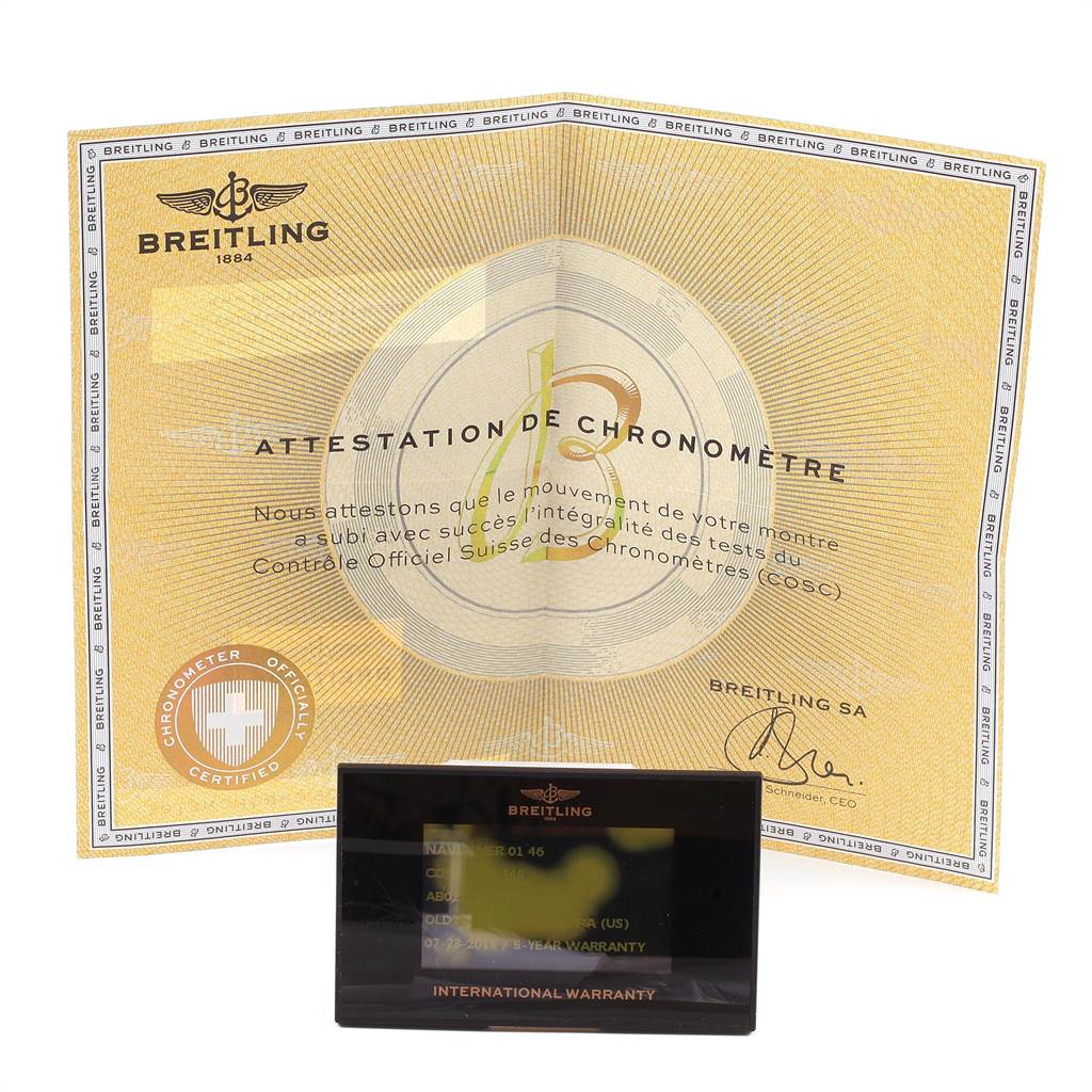 The image shows a Breitling Navitimer AB012721-C889-453A Men's Stainless Steel Blue Dial AB012721-C889-453A Men's Stainless Steel Blue Dial warranty card and an official chronometer certificate from an overhead angle.