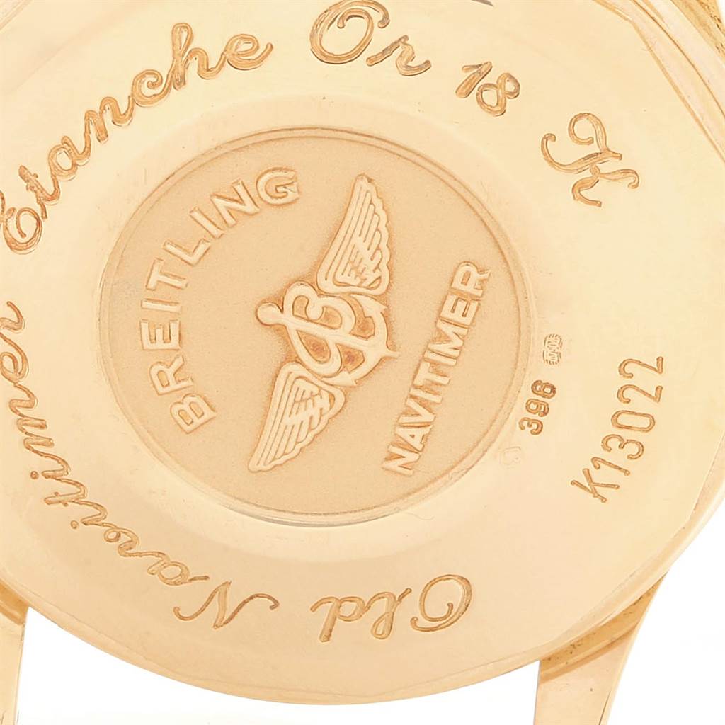 This image shows the back case of a Breitling Navitimer K13022 Men
s Yellow Gold Black Dial K13022 Men
s Yellow Gold Black Dial watch, highlighting the engraved brand logo and model details.