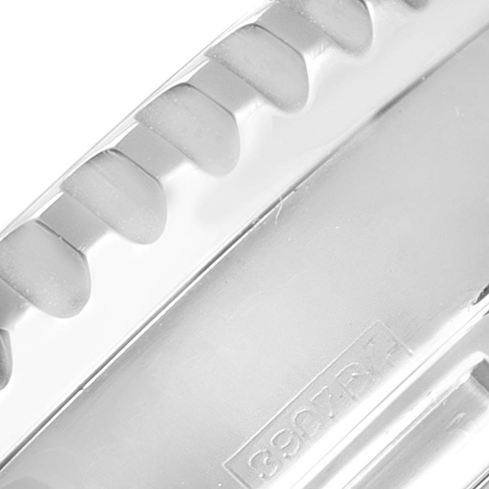 This close-up image shows a part of the bezel and an engraved serial number of a Breitling Navitimer A23322 Men's Stainless Steel Black Dial A23322 Men's Stainless Steel Black Dial watch.