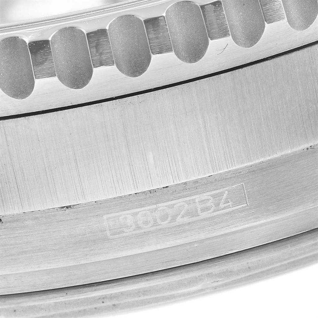 This close-up shows the partial bezel and etched serial number of a Breitling Navitimer A41322 Men
s Stainless Steel Black Dial A41322 Men
s Stainless Steel Black Dial watch.