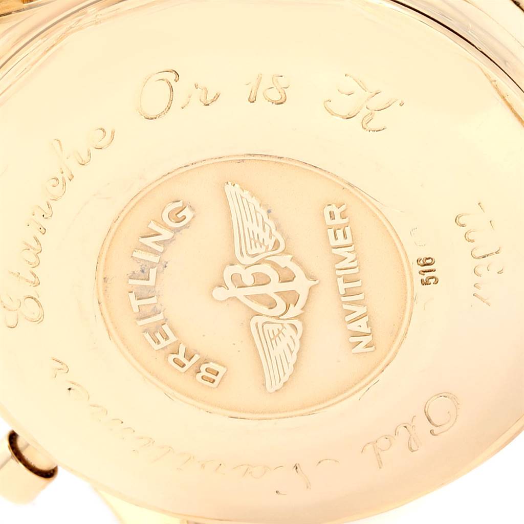 The image shows the back case of a Breitling Navitimer K13022 Men's Yellow Gold Black Dial K13022 Men's Yellow Gold Black Dial watch, highlighting the engraving details and logo.