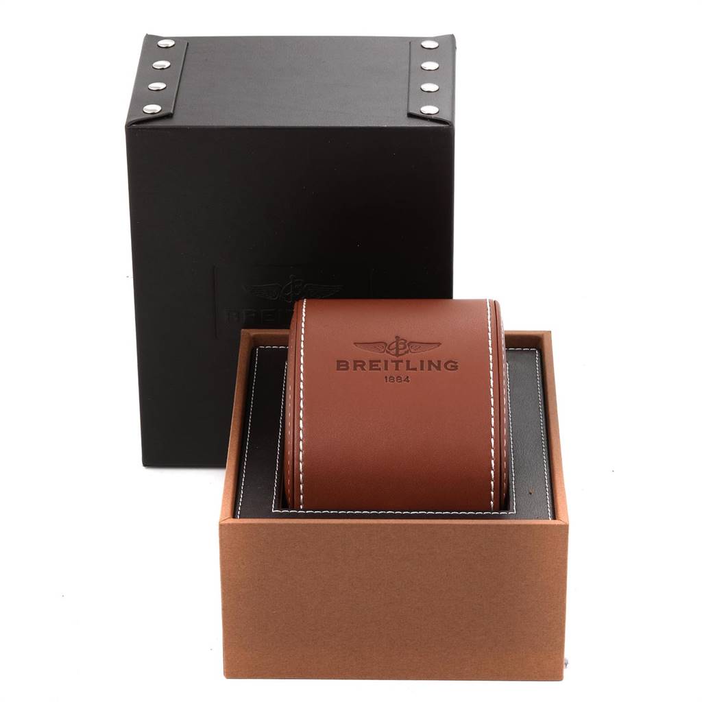 The image shows the packaging box and the leather case of a Breitling Navitimer K13022 Men's Yellow Gold Black Dial K13022 Men's Yellow Gold Black Dial watch from a front angle.