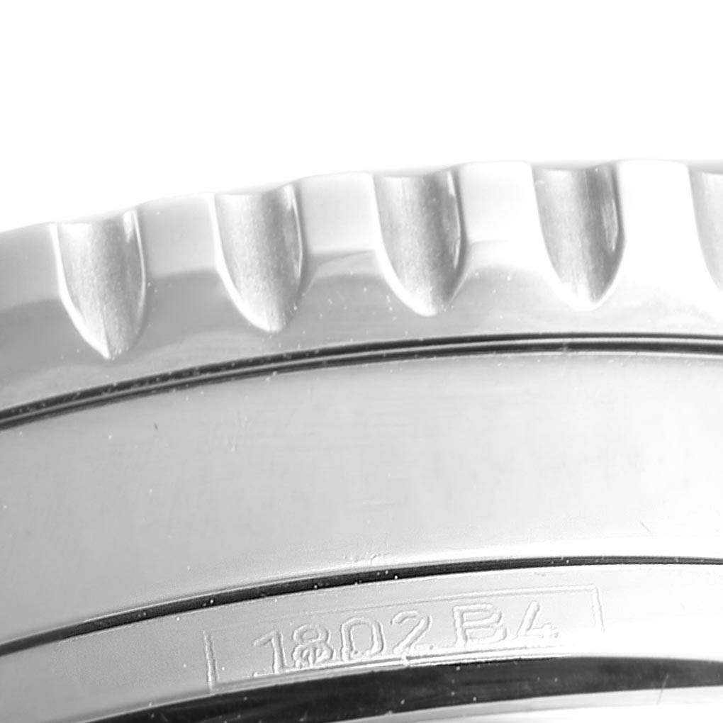 The image shows a close-up of the bezel and edge of the case of a Breitling Navitimer A13322 Men's Stainless Steel Blue Dial A13322 Men's Stainless Steel Blue Dial watch.