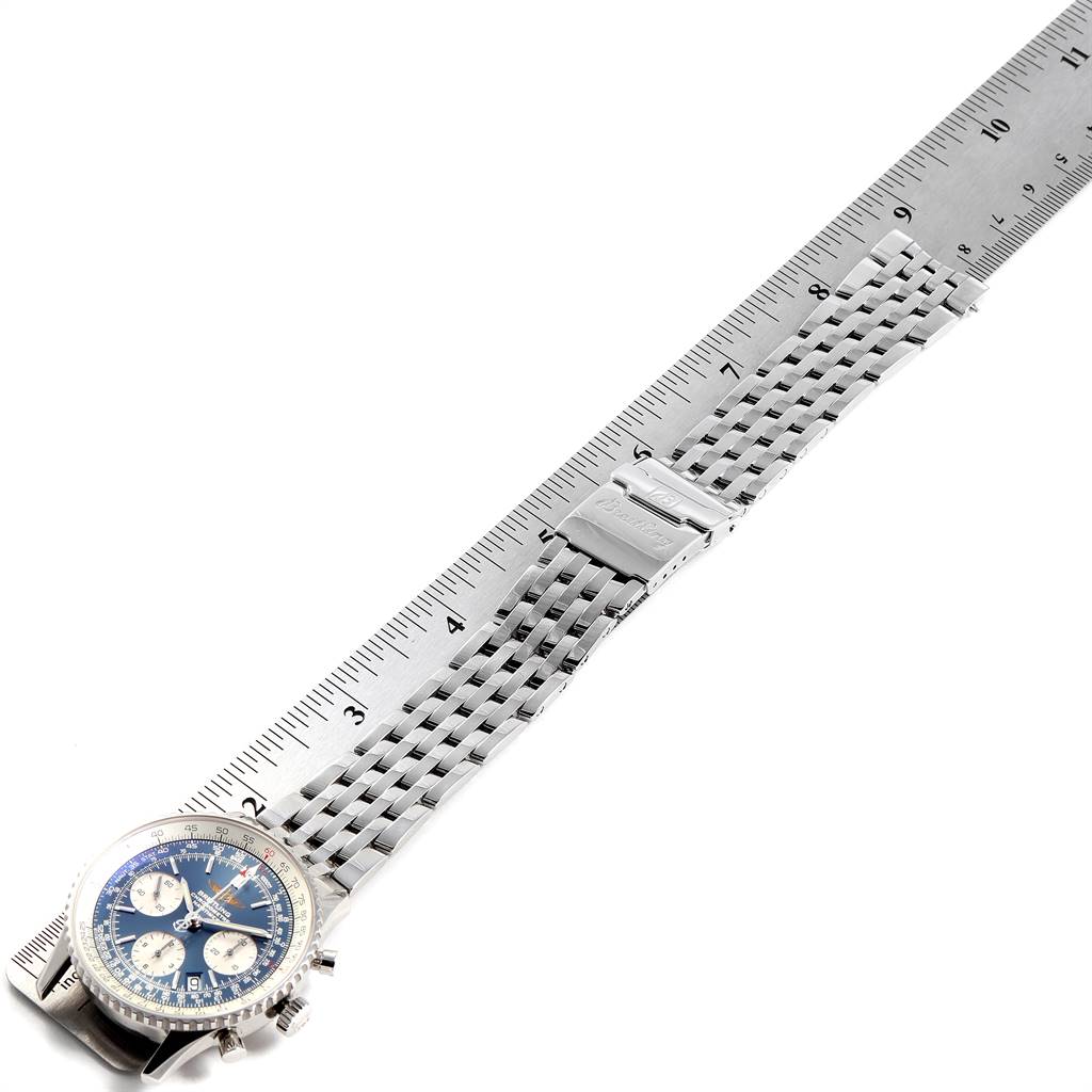 The Breitling Navitimer A23322 Men's Stainless Steel Blue Dial A23322 Men's Stainless Steel Blue Dial watch is shown from a top-down angle, displaying its face, bracelet, and clasp alongside a ruler for scale.