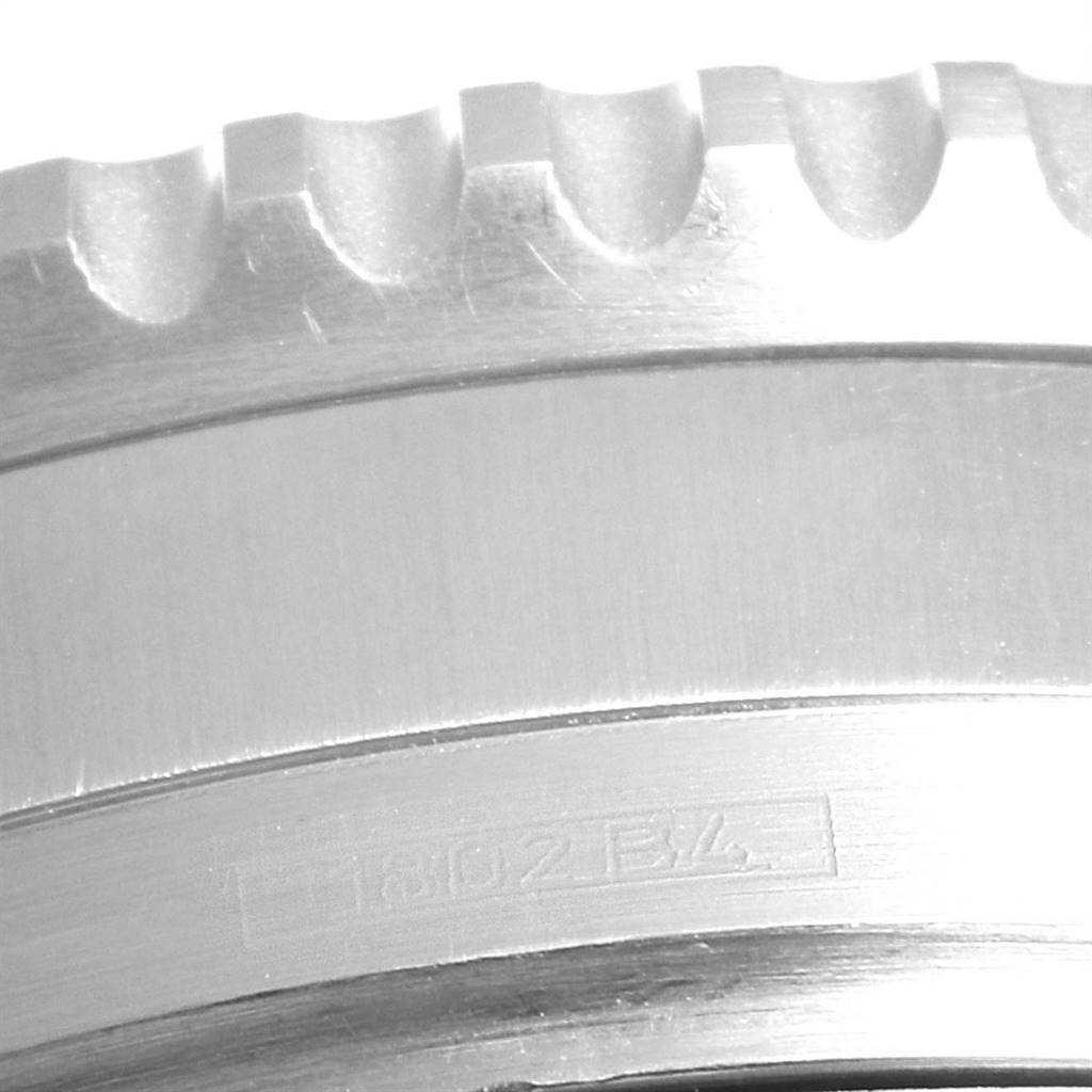 This close-up image shows the engraved stainless steel bezel of a Breitling Navitimer A41322 Men's Stainless Steel Black Dial A41322 Men's Stainless Steel Black Dial watch.