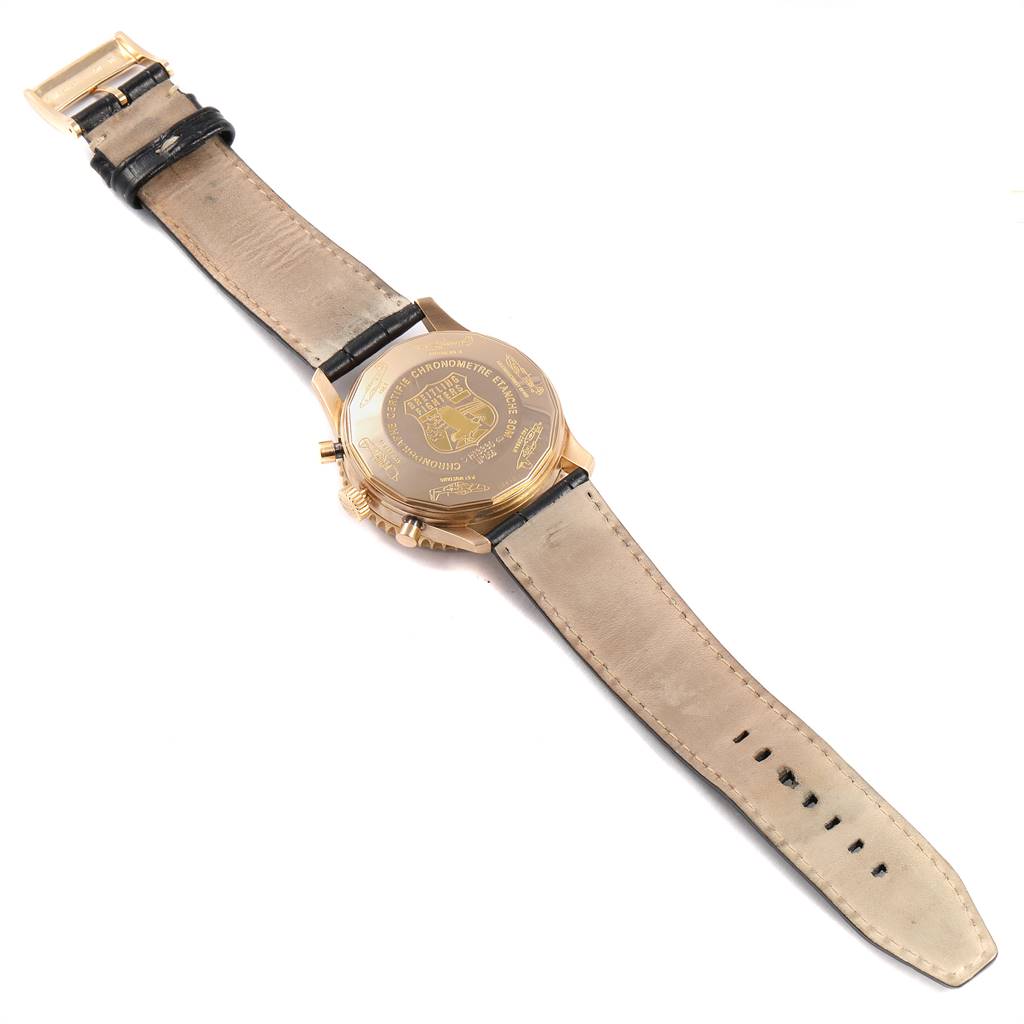 The image shows the back view of a Breitling Navitimer H13330 Men's Yellow Gold Black Dial H13330 Men's Yellow Gold Black Dial watch, displaying the case back and leather strap laid flat.