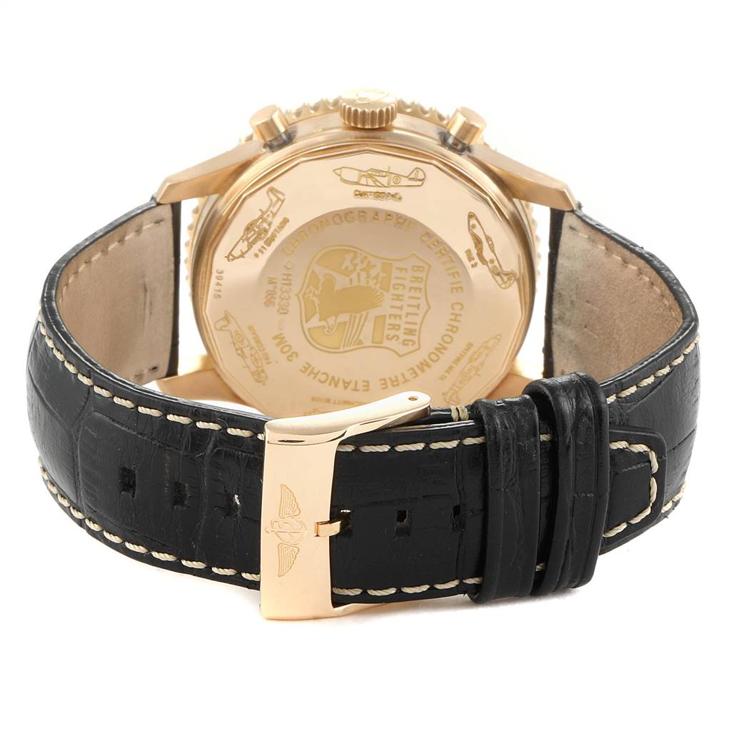The image shows the back view of a Breitling Navitimer H13330 Men's Yellow Gold Black Dial H13330 Men's Yellow Gold Black Dial watch with a black leather strap and a gold buckle.