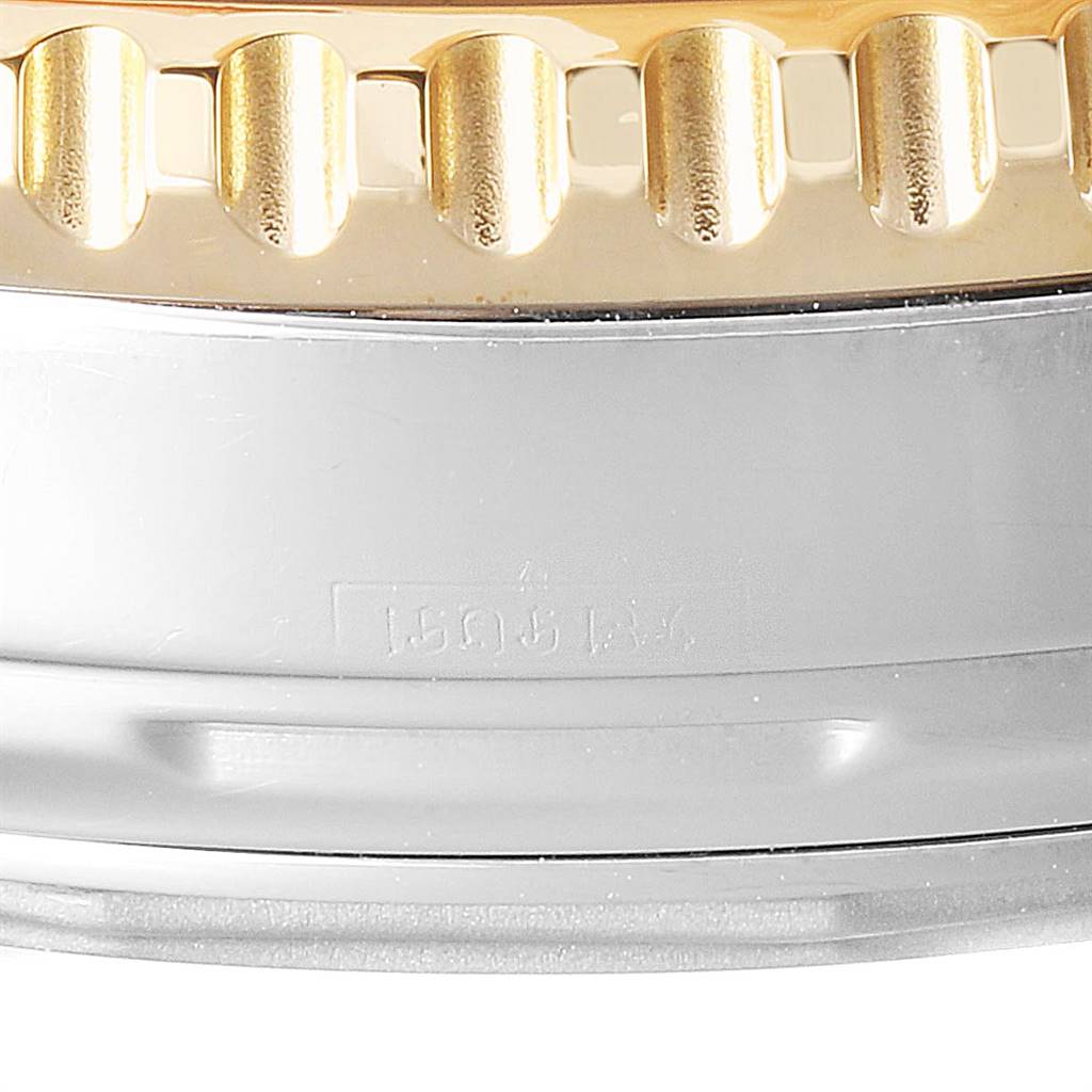 This image shows a close-up of the Breitling Navitimer D23322 Men
s Stainless Steel Black Dial D23322 Men
s Stainless Steel Black Dial watch bezel and part of the case.