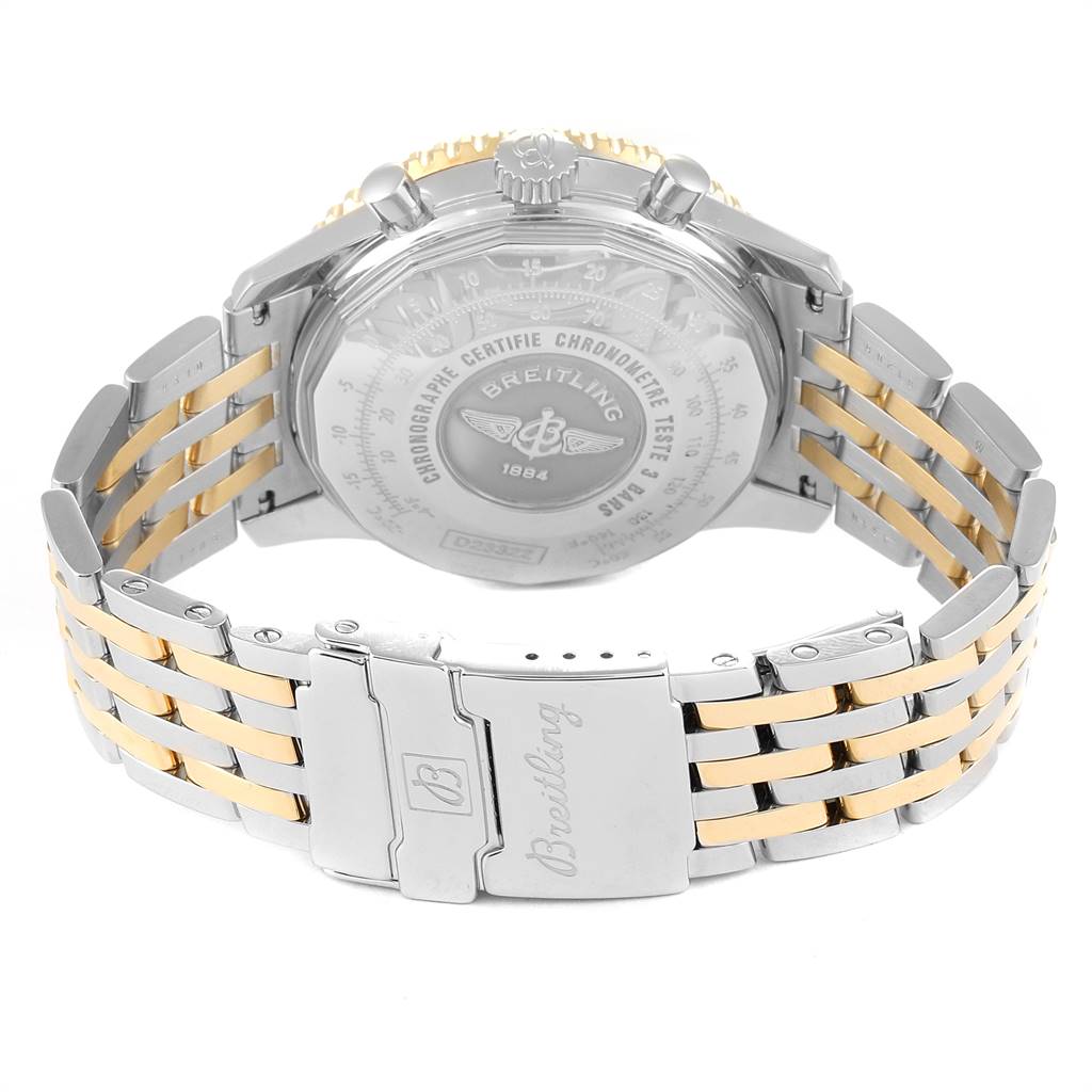 The image shows a rear angle of the Breitling Navitimer D23322 Men
s Stainless Steel Black Dial D23322 Men
s Stainless Steel Black Dial, focusing on the case back and two-tone metal bracelet.