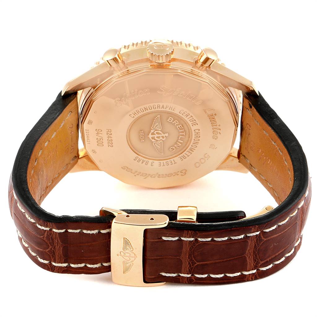 The image shows the back case and strap of a Breitling Navitimer R24322 Men's Rose Gold Black Dial R24322 Men's Rose Gold Black Dial watch, highlighting the engraved details and clasp.