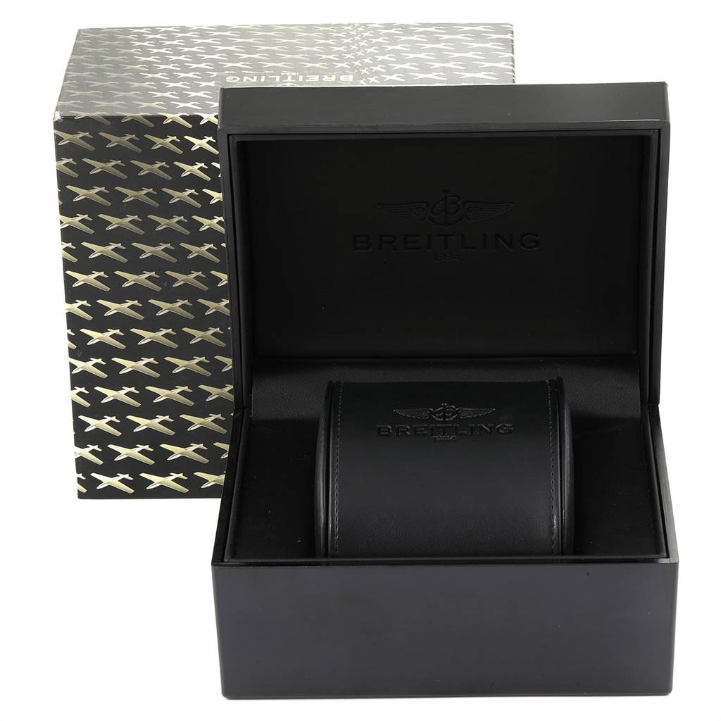 The image displays a Breitling Navitimer R24322 Men's Rose Gold Black Dial R24322 Men's Rose Gold Black Dial watch box and container with the lid open, revealing a leather watch holder inside.