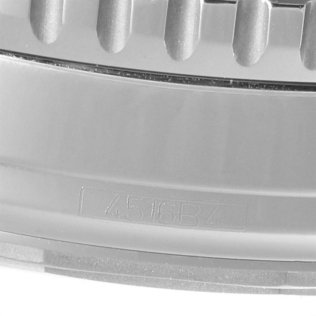 The image shows a close-up of the edge and serial number of a Breitling Navitimer A13324 Men's Stainless Steel Blue Dial A13324 Men's Stainless Steel Blue Dial watch.
