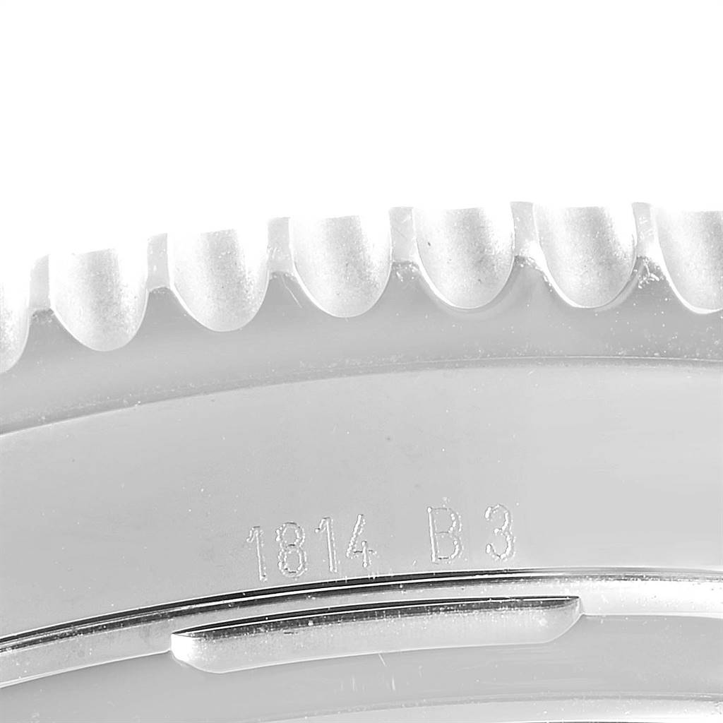 This image shows a close-up of the bezel and engraving on the Navitimer model by Breitling.