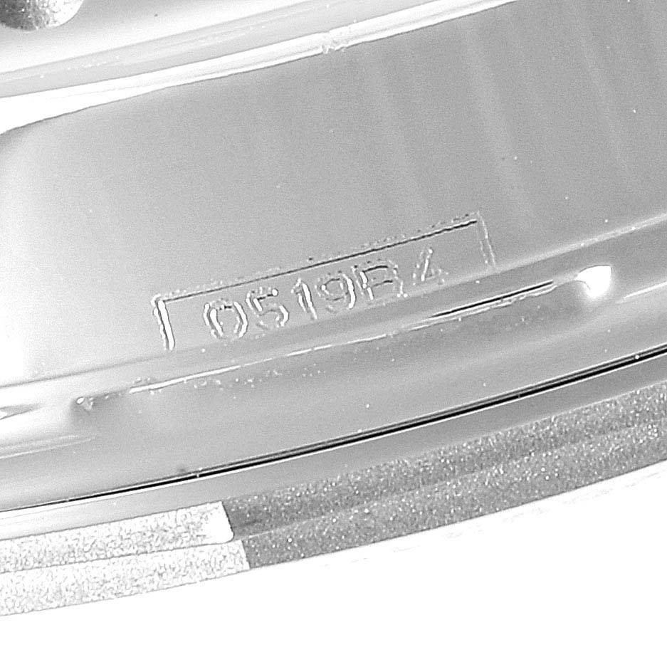 The image shows a close-up angle of the case back of a Breitling Navitimer AB0121 Men
s Stainless Steel Black Dial AB0121 Men
s Stainless Steel Black Dial watch, highlighting a reference number.